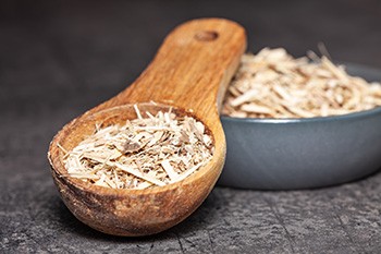 Dried,Root,Of,Siberian,Ginseng,On,Dark,Background,-,Medicine