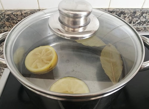 What Happens If You Mix Lemon with Bay Leaves - adding lemon to pan