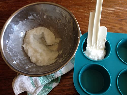 DIY Anti-Microbial Herbal Laundry Soap- pouring soap into molds