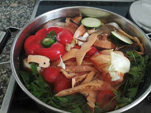 Homemade Healing Broth from Vegetable Scraps -putting vegetables in water