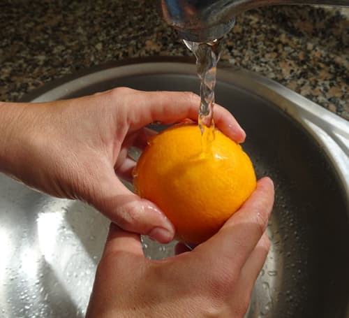 What Happens if You Boil An Orange- washing the orange