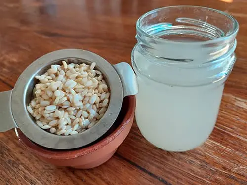 Straining Rice Water Fermented Rice Water - The Lost Herbs