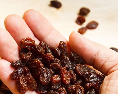 What Happens If You Drink Raisin Water- handful of raisins