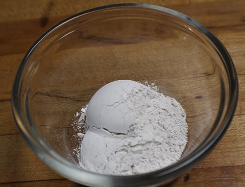 Homemade Bug Bite Powder -place the white clay in bowl