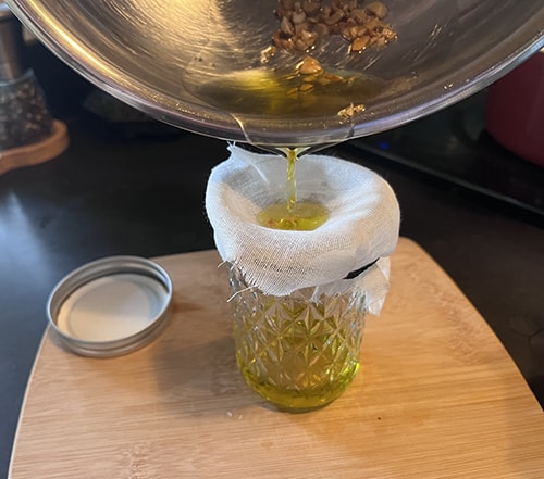 strain garlic oil