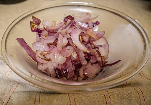 DIY Onion Poultice for Congested Coughs - scrape onion in a bowl