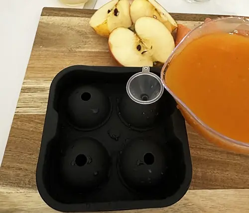 Jello Flu Shots pour mixture in molds