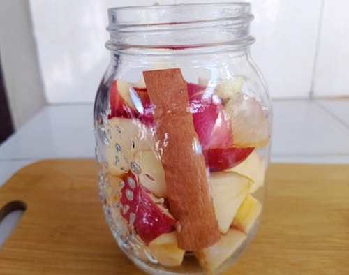 DIY Probiotic Fermented Apples- put the apples in the jar