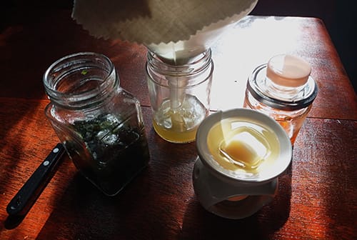 Homemade Herbal Rub for Eczema & Psoriasis- strain the petals and the leaves