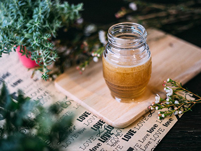 jar-of-honey-on-table-with-botanicals copy