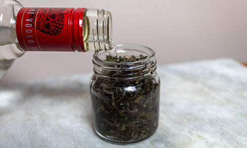 04 Pouring Alcohol Vodka over Oregano