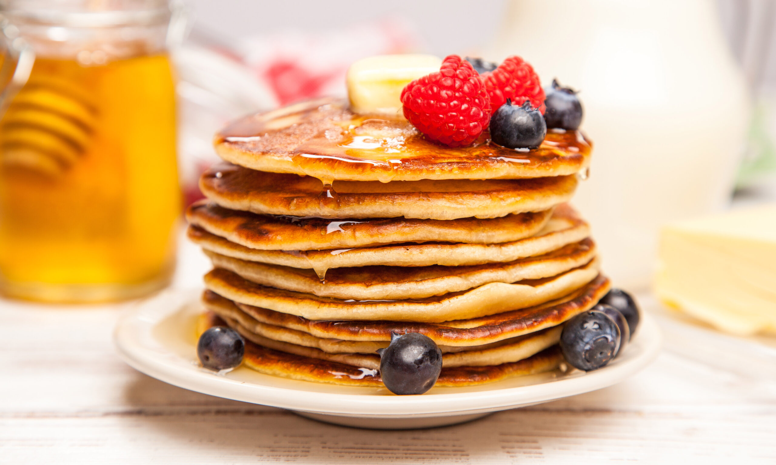 High pile of delicious pancakes with blueberry