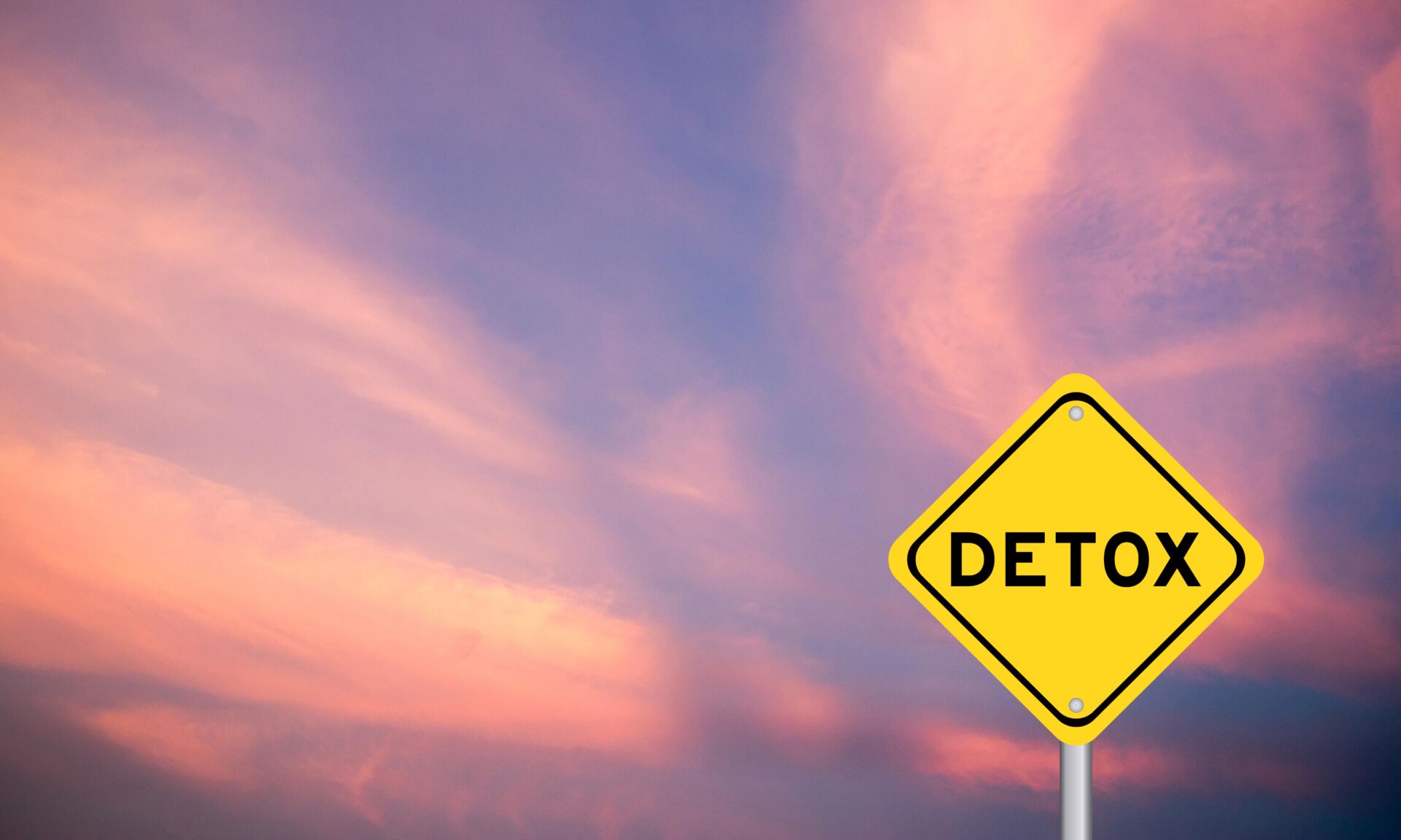 Yellow transportation sign with word detox on blue color sky background
