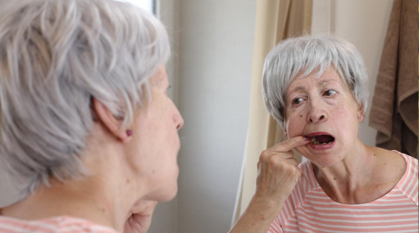 Woman checking her tooth pain