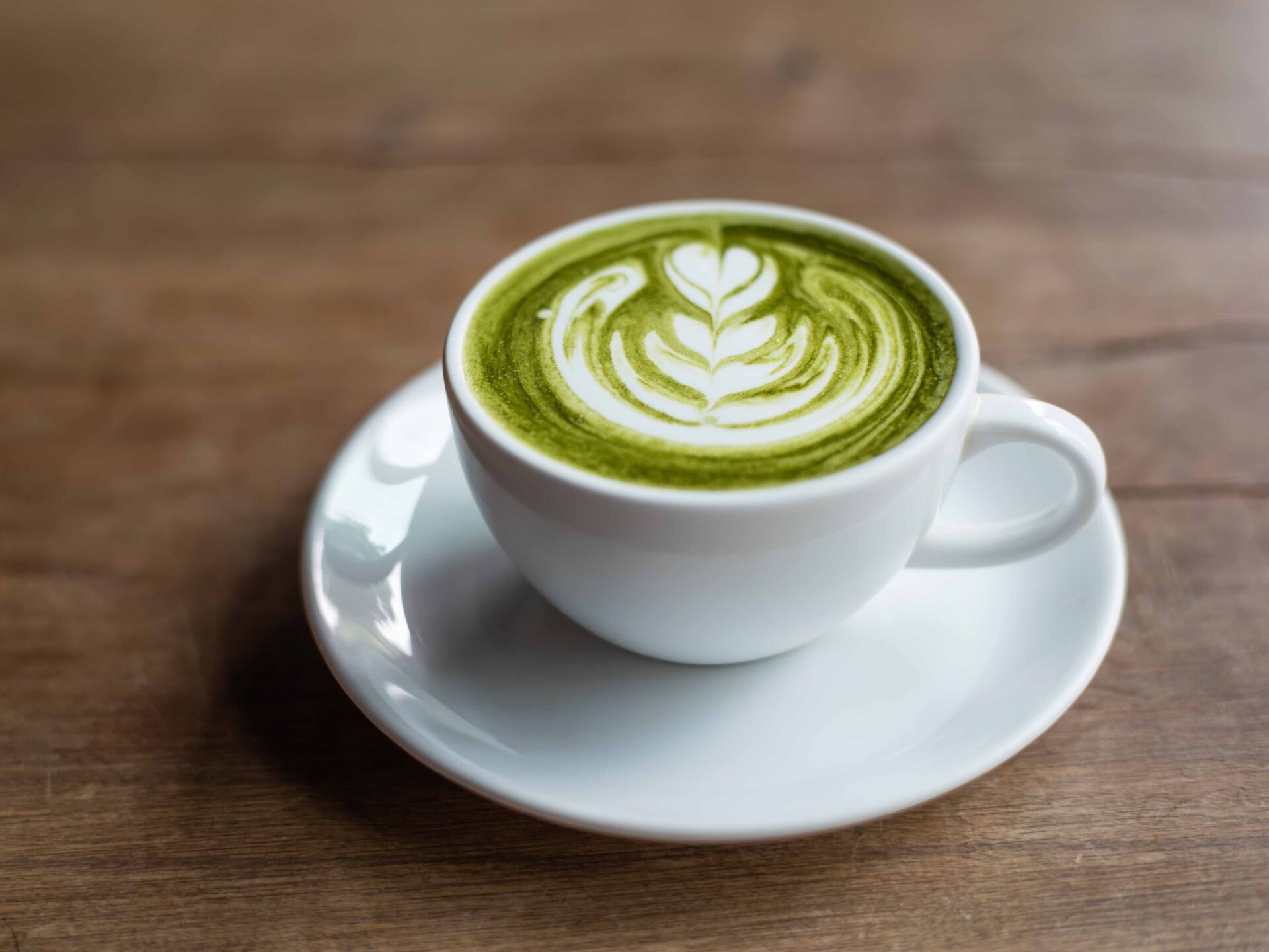 matcha latte on wooden background